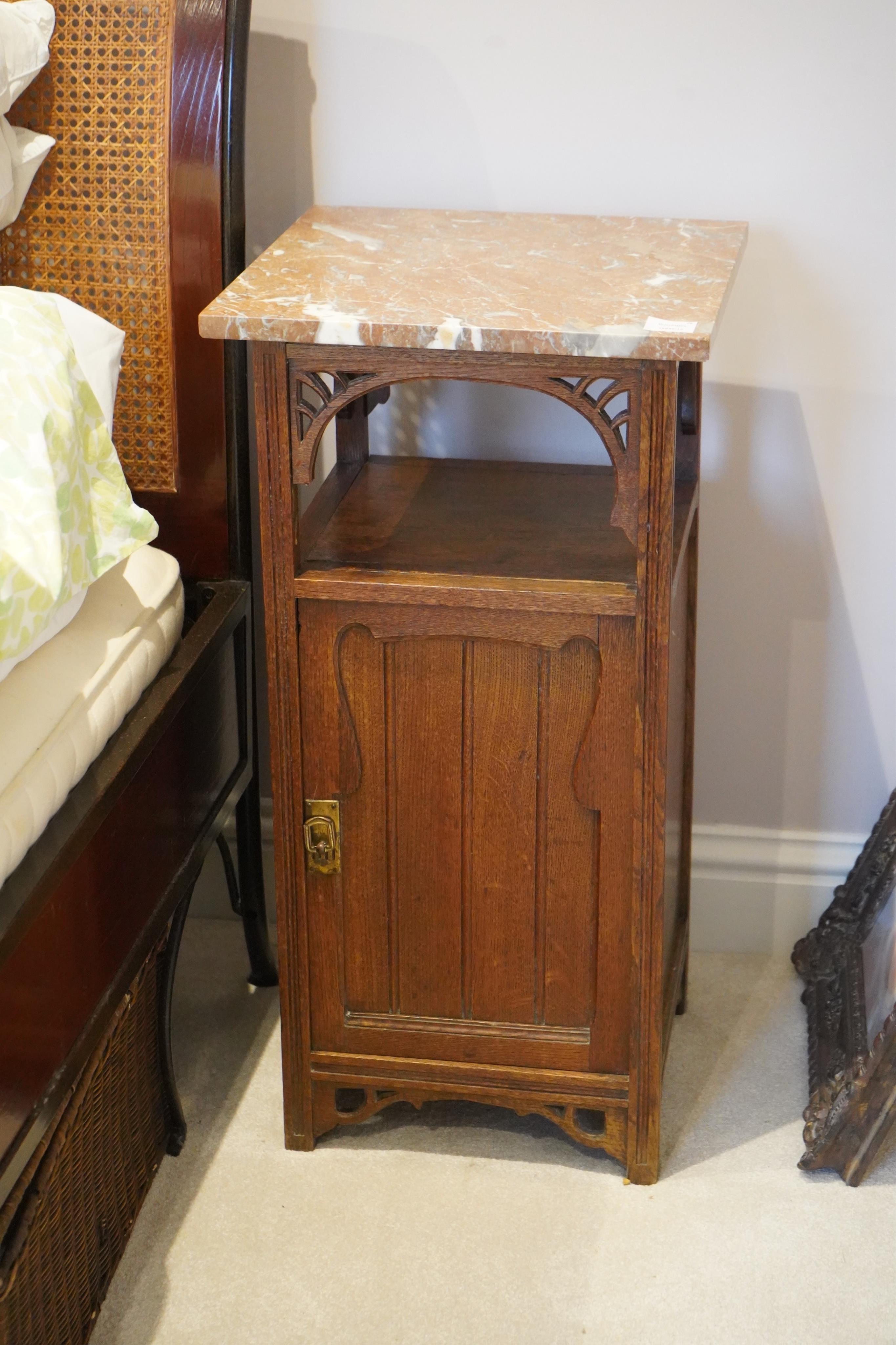 A pair of French Art Nouveau oak marble topped bedside cupboards, width 42cm, depth 42cm, height 81cm. Condition - fair